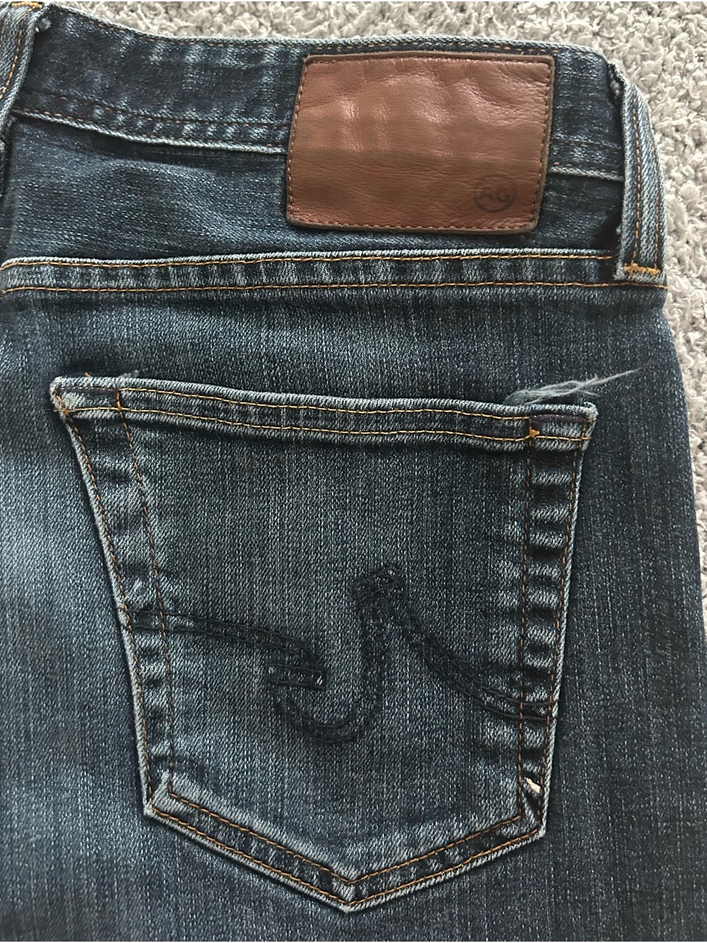 Ag Adriano Goldschmied Men's Straight Jeans in Dark Blue with Brown Patch